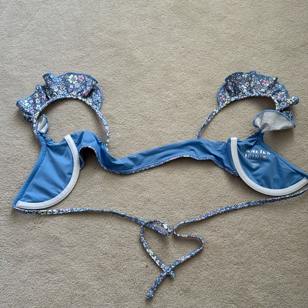 Light blue floral print bikini top with flutter shoulder straps and underwire.